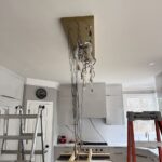 heavy chandelier installation above kitchen island in alpharetta, ga 2