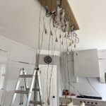 heavy chandelier installation above kitchen island in alpharetta, ga 3