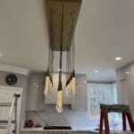 heavy chandelier installation above kitchen island in alpharetta, ga 4